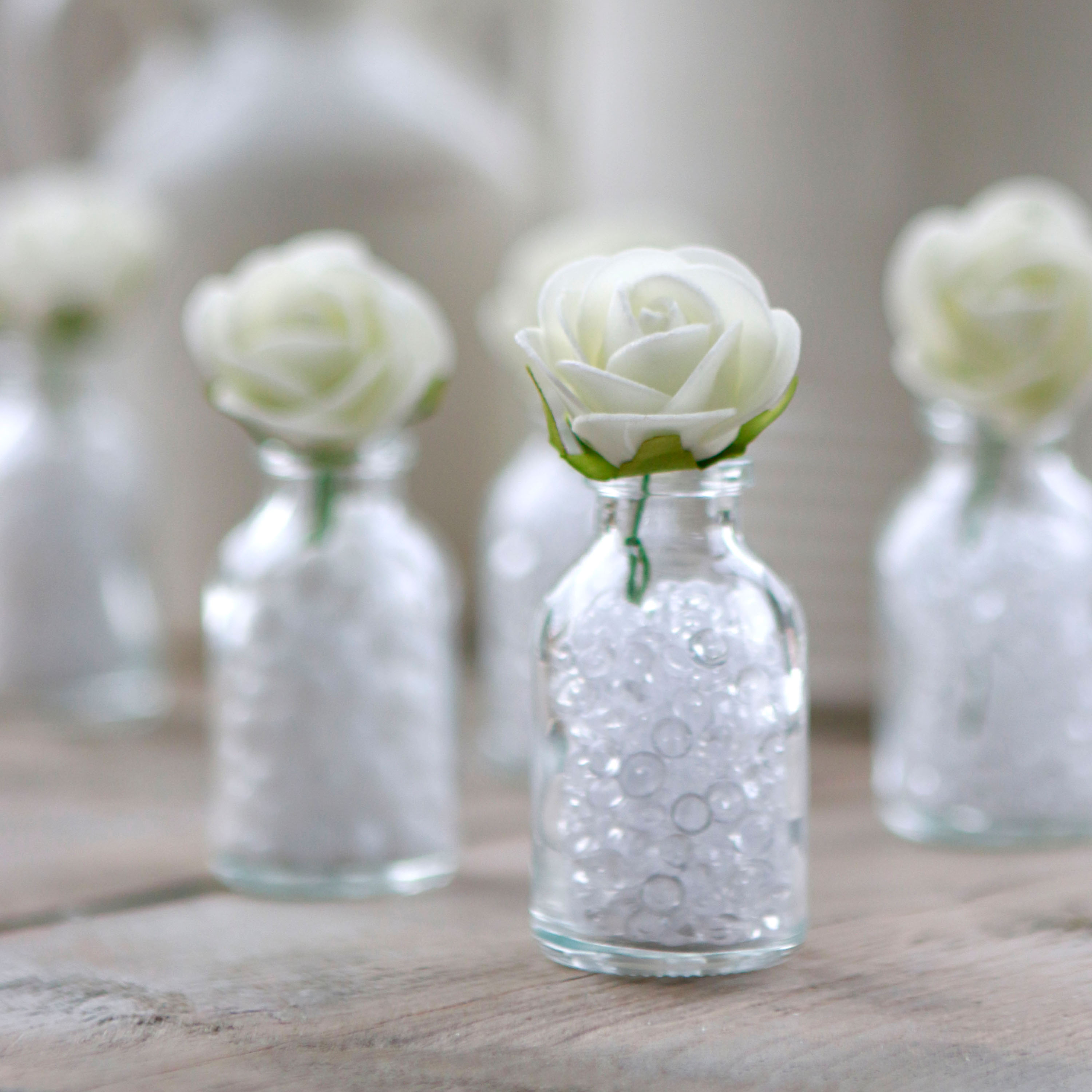 22000-22100-28072-31101-glass-bottle-h-10cm-with-foam-roses-11